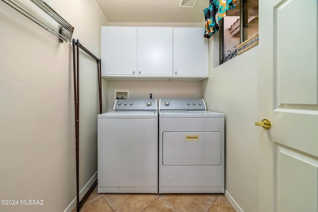 63506 E Harmony Dr, Tucson, AZ 85739 - washroom with cabinets, light tile patterned floors, and separate washer and dryer