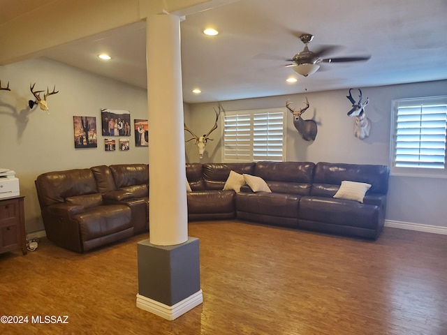 living room featuring wood-type flooring and ceiling fan