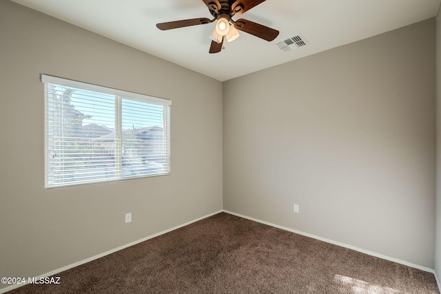 spare room with ceiling fan and carpet floors