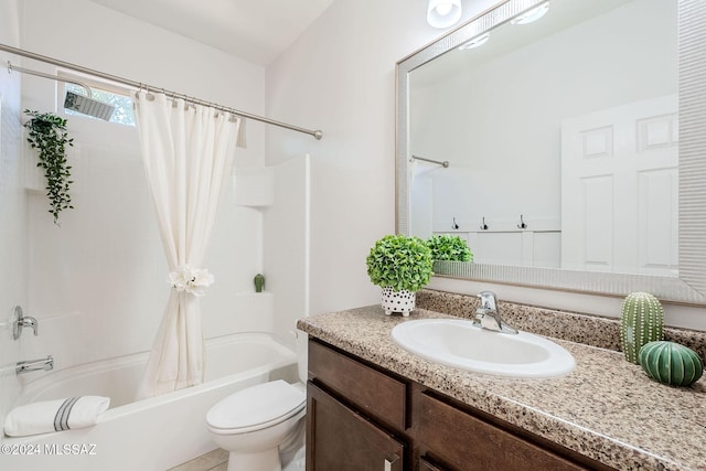 full bathroom with shower / bath combination with curtain, vanity, and toilet