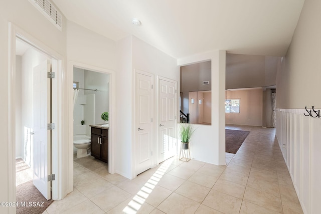 hallway featuring light tile patterned flooring