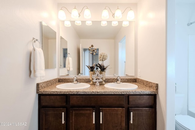 bathroom with vanity and toilet