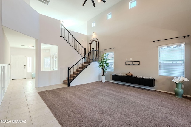 interior space featuring a towering ceiling and a wealth of natural light