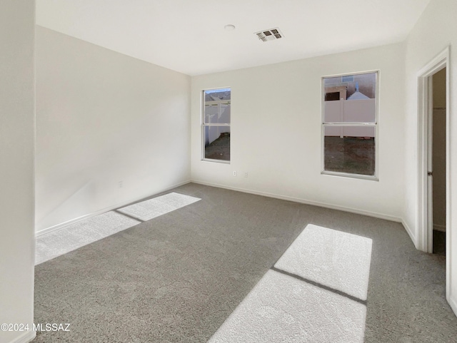 unfurnished room featuring carpet