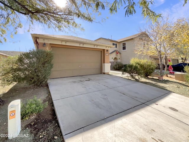 ranch-style house featuring a garage