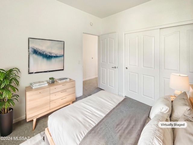 carpeted bedroom featuring a closet