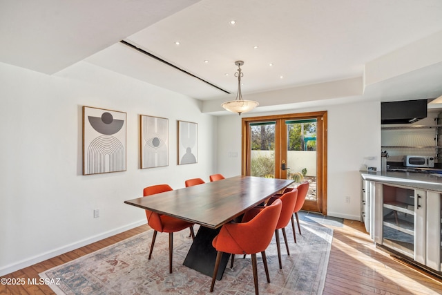 dining space featuring french doors and light hardwood / wood-style floors