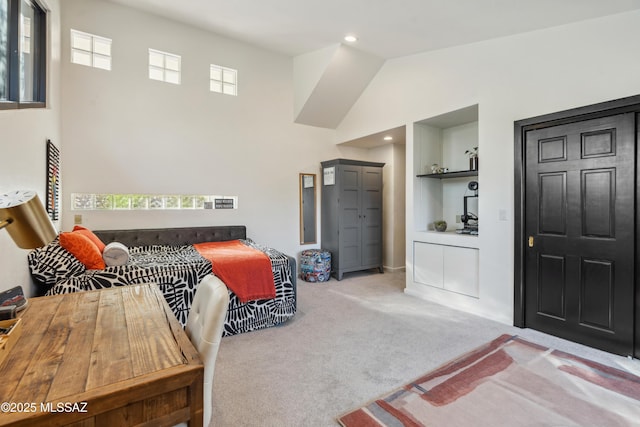 bedroom featuring light colored carpet