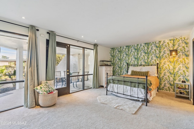 carpeted bedroom with french doors and access to exterior