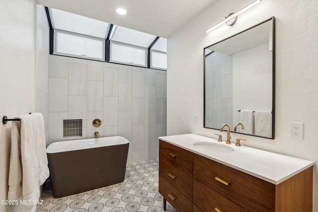 bathroom featuring vanity and a bathtub