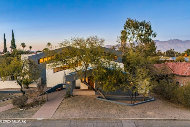 view of front of property with a mountain view