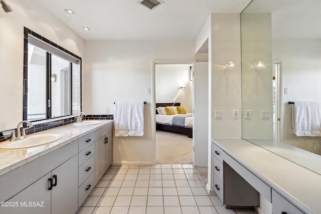 bathroom with vanity and tile patterned floors