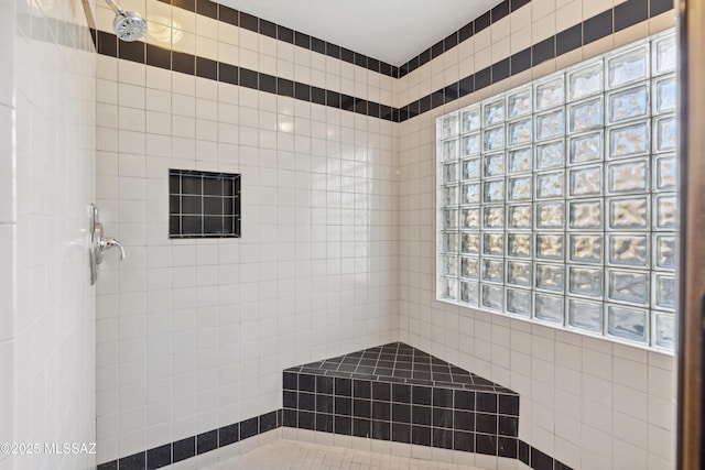 bathroom featuring tiled shower