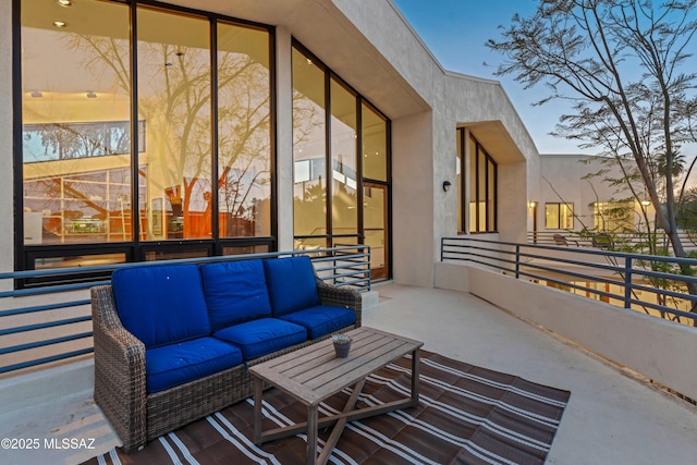 patio terrace at dusk with an outdoor living space