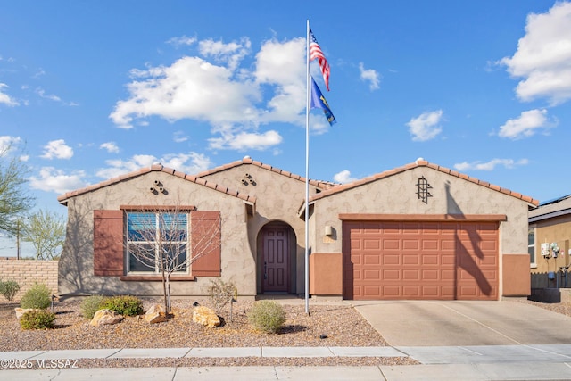 mediterranean / spanish-style house featuring a garage