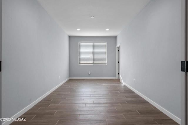 spare room featuring dark wood-type flooring