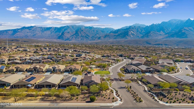 birds eye view of property featuring a mountain view