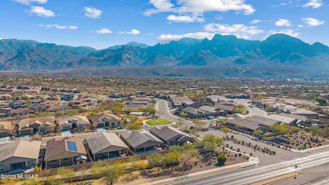 birds eye view of property with a mountain view