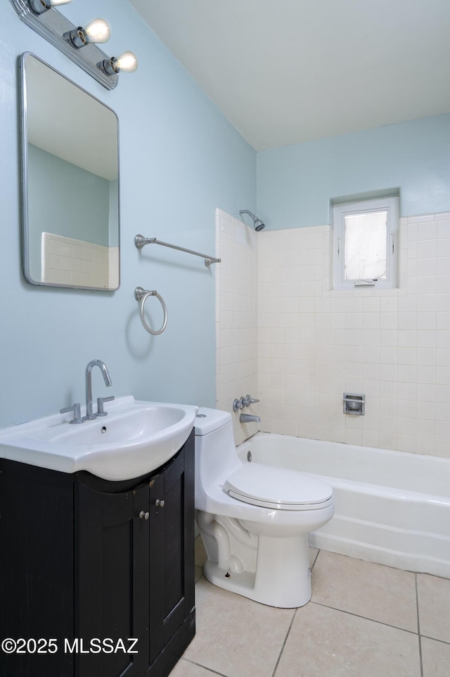 full bathroom with toilet, vanity, tiled shower / bath combo, and tile patterned flooring