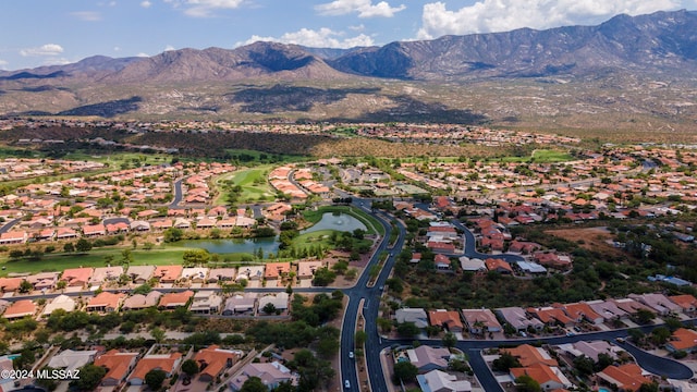 drone / aerial view with a water and mountain view