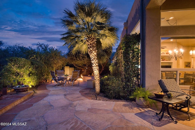 view of patio terrace at dusk