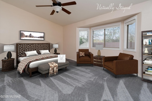 carpeted bedroom featuring vaulted ceiling and ceiling fan