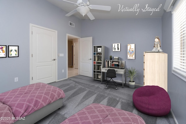 bedroom featuring carpet, multiple windows, and ceiling fan