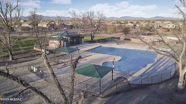 view of pool with a patio area and a mountain view