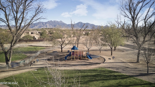 view of playground featuring a mountain view