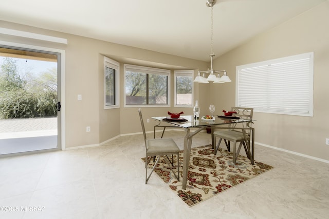 dining space with a notable chandelier and vaulted ceiling