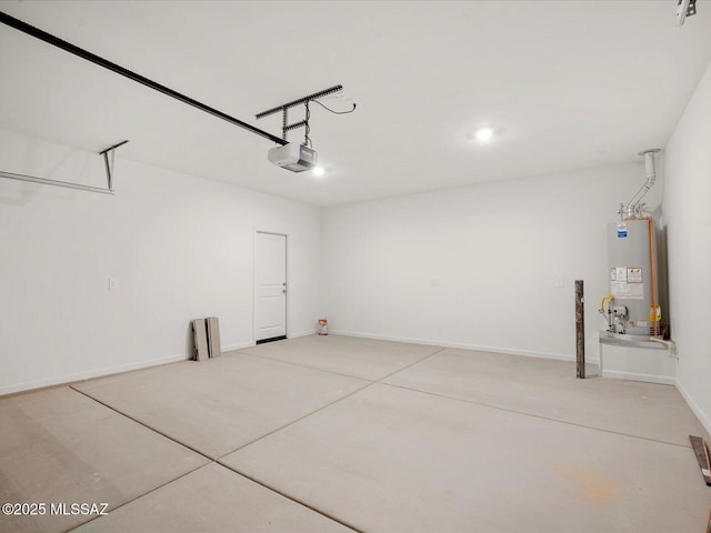 garage with baseboards, a garage door opener, and water heater