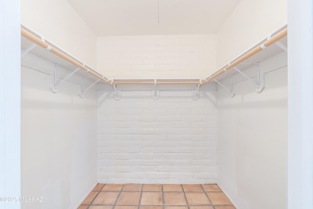 spacious closet with tile patterned flooring