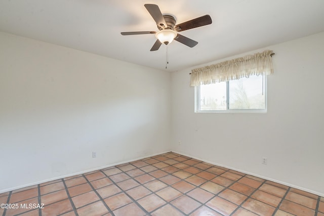 spare room with ceiling fan