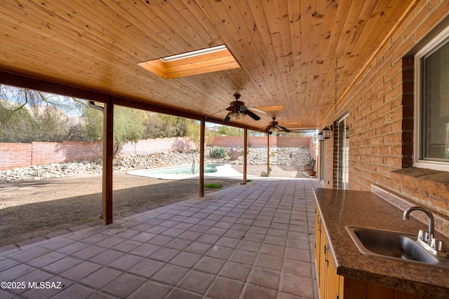 view of patio with sink and ceiling fan