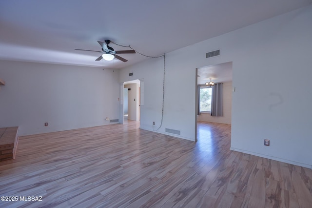 unfurnished room with ceiling fan and light wood-type flooring