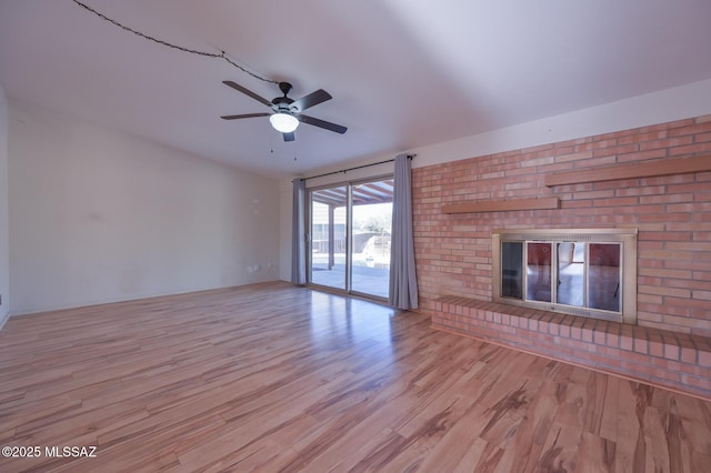 unfurnished living room featuring ceiling fan and light hardwood / wood-style flooring