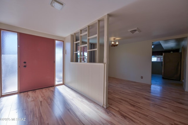 foyer with hardwood / wood-style flooring