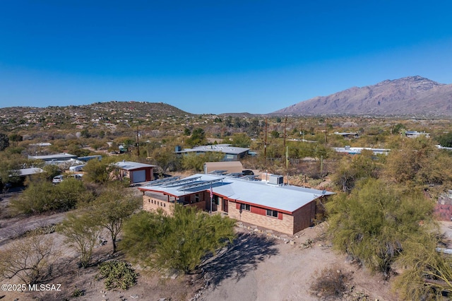 birds eye view of property with a mountain view