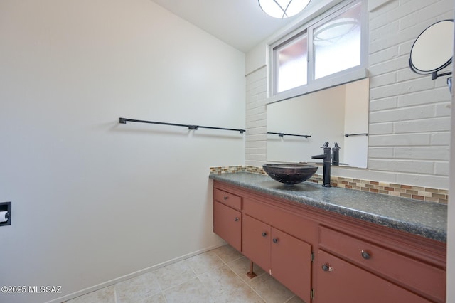 bathroom with vanity and lofted ceiling