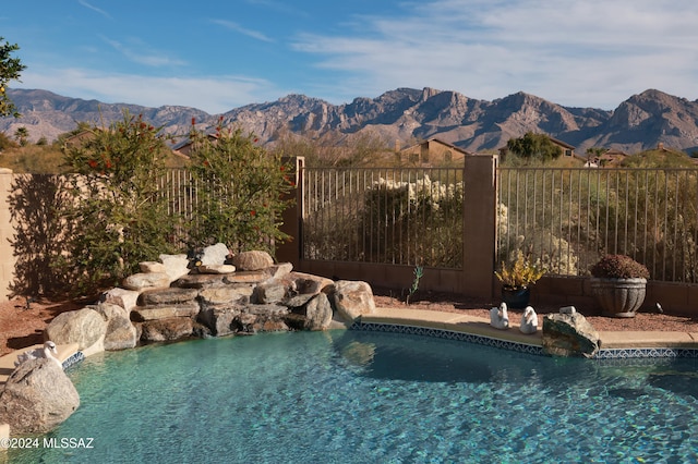 view of pool featuring pool water feature and a mountain view