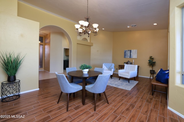 dining space with a chandelier