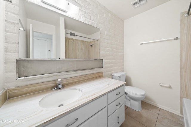 full bathroom with tile patterned flooring, bathtub / shower combination, vanity, and toilet