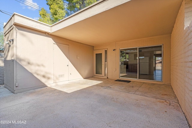 doorway to property featuring a patio