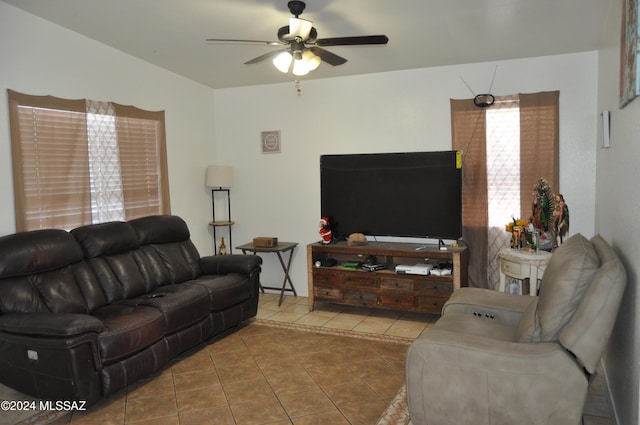 living room with tile patterned floors and ceiling fan