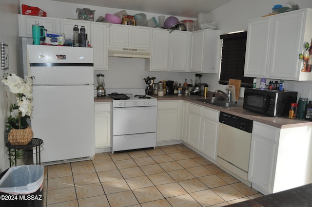 kitchen with white cabinets, white appliances, sink, and light tile patterned floors