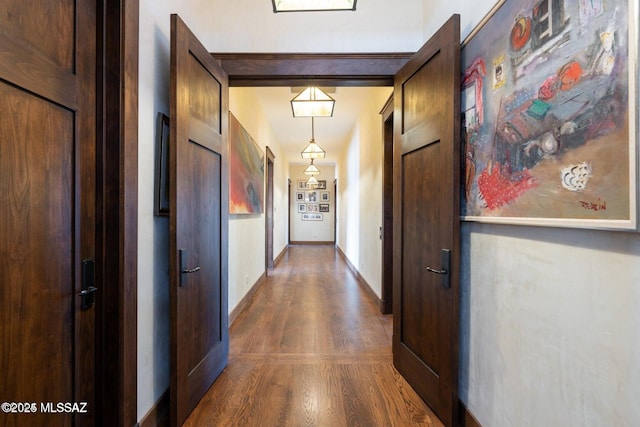 corridor with dark wood-type flooring