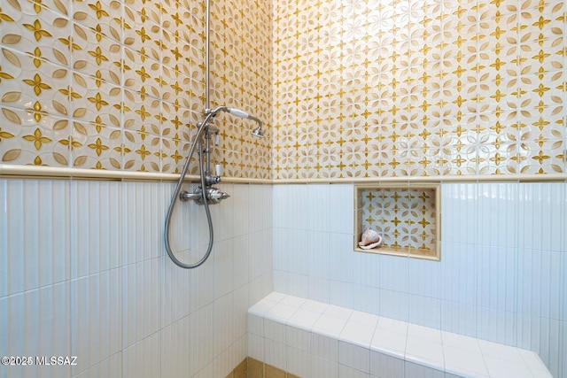 bathroom with tiled shower