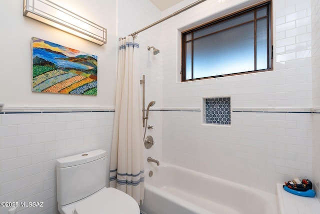 bathroom with toilet, shower / bathtub combination with curtain, and tile walls