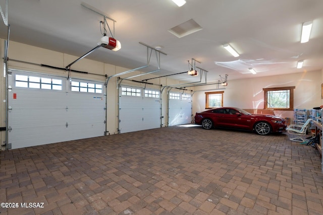 garage featuring a garage door opener