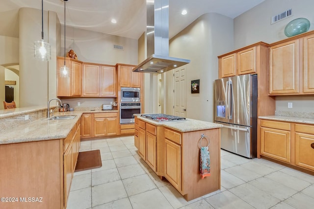 kitchen featuring sink, island exhaust hood, a high ceiling, pendant lighting, and appliances with stainless steel finishes